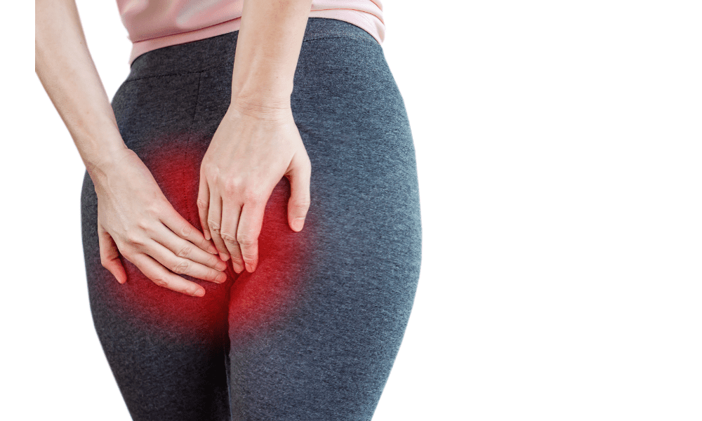 woman holding butt due to pain caused by hemorrhoid