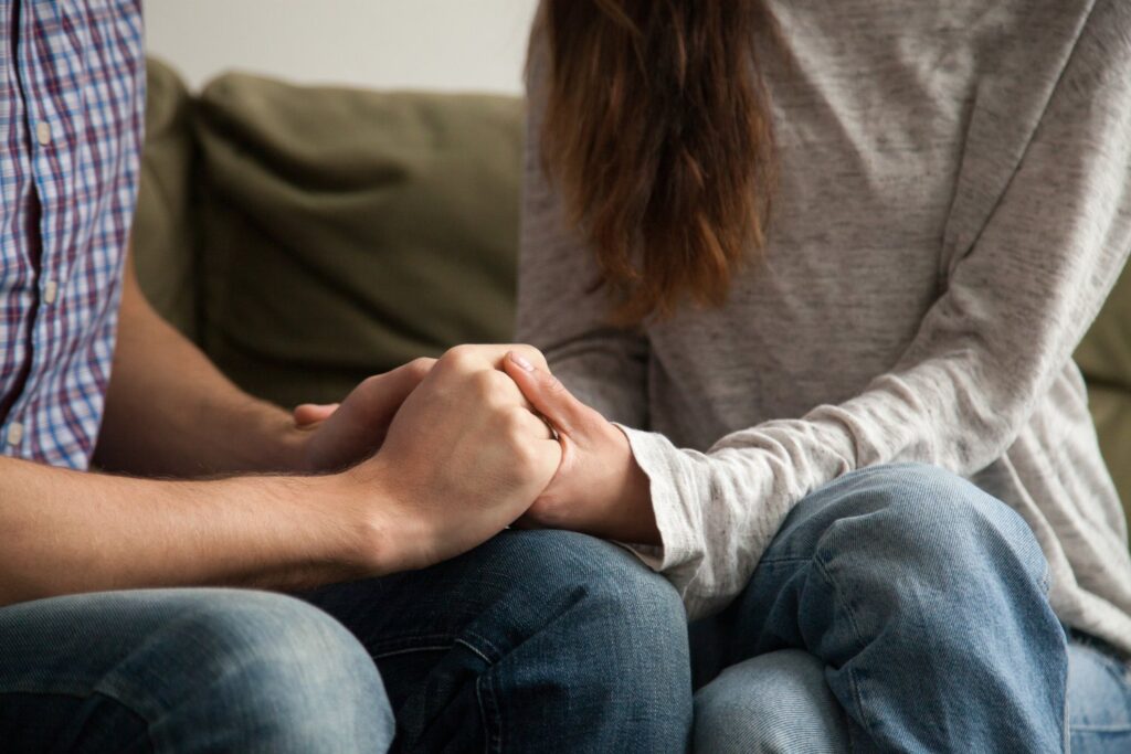 two people holding hands